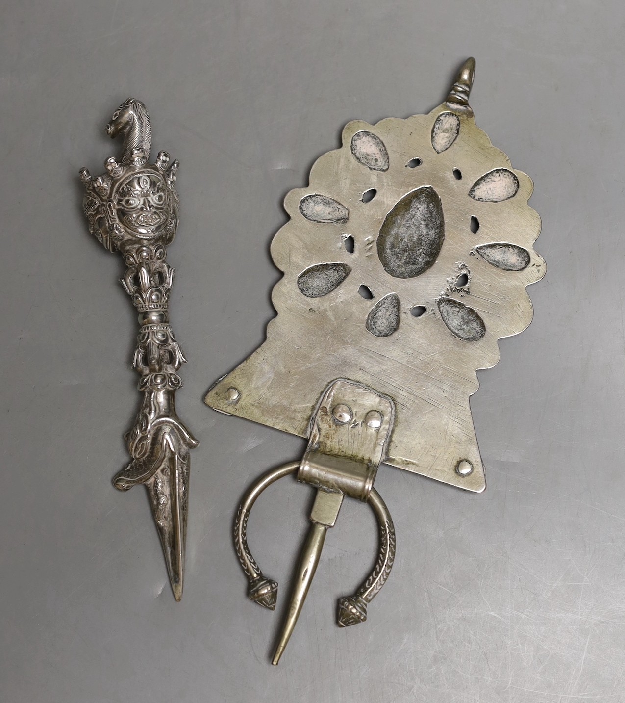 A Tibetan metal phurba and a South Asian metal finial, finial 22cms high.